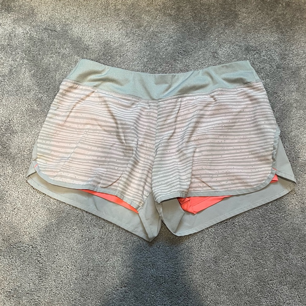 Women’s pink and grey Layer 8 performance shorts